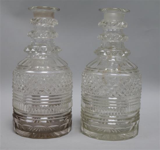 A pair of Regency cut glass mallet shaped decanters (lacking stoppers)